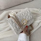 Moodne metallist kinnitusega naistekott