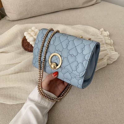 Moodne metallist kinnitusega naistekott