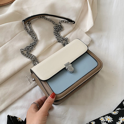 Bőr kézitáska hosszú fém fogantyúval