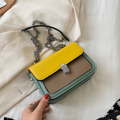 Bőr kézitáska hosszú fém fogantyúval