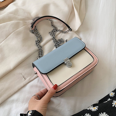 Bőr kézitáska hosszú fém fogantyúval