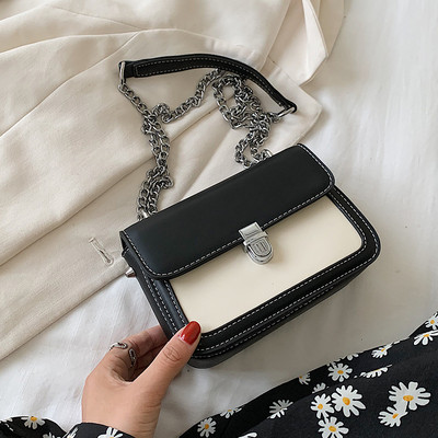 Bőr kézitáska hosszú fém fogantyúval