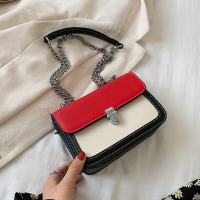 Bőr kézitáska hosszú fém fogantyúval