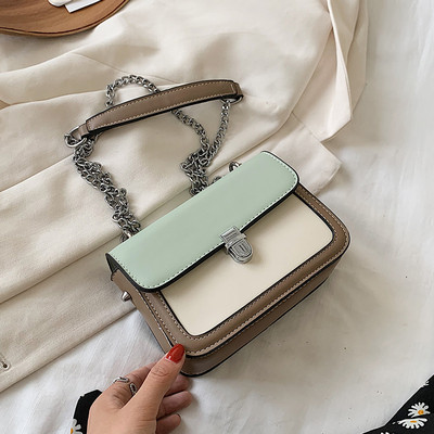 Bőr kézitáska hosszú fém fogantyúval