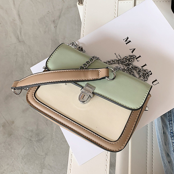 Bőr kézitáska hosszú fém fogantyúval