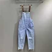 Női farmer overall új modellje szakadt motívumokkal