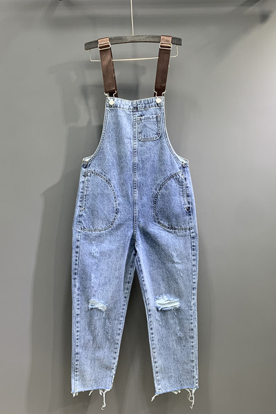 Női farmer overall új modellje szakadt motívumokkal