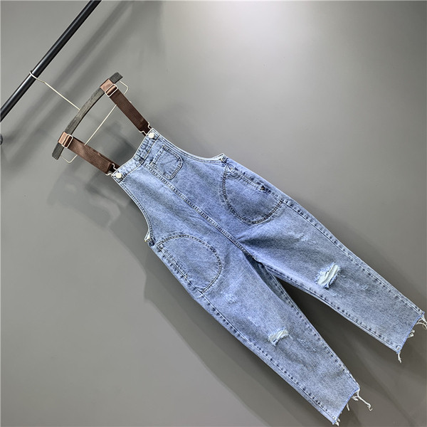 Női farmer overall új modellje szakadt motívumokkal