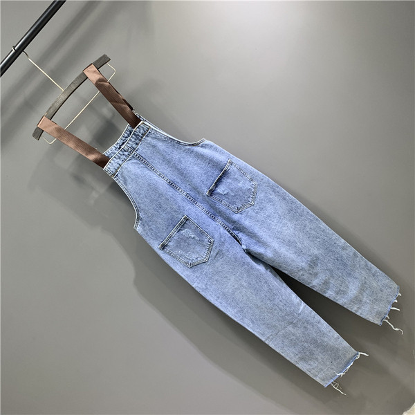 Női farmer overall új modellje szakadt motívumokkal