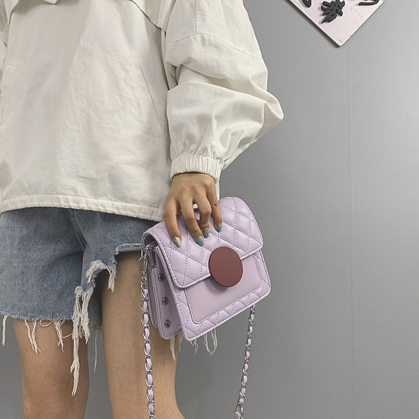 Női táska hosszú fém fogantyúval, öko bőrből