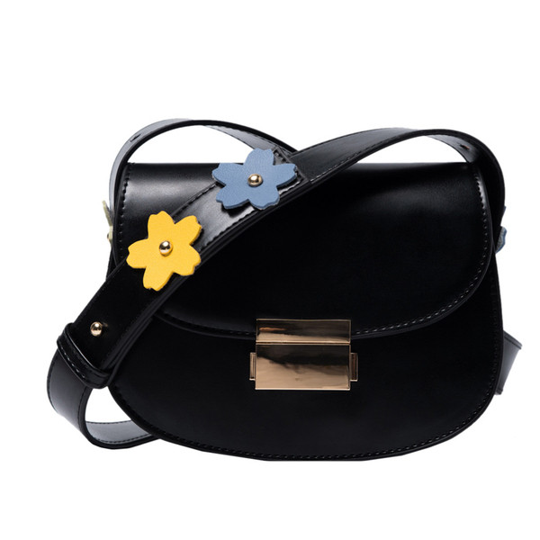 Női táska fém rögzítéssel, bőr fogantyúval