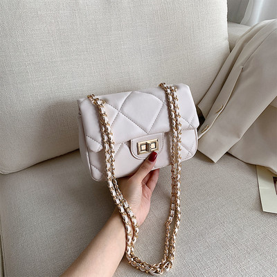 Modern női táska öko bőrből és hosszú fém fogantyúval