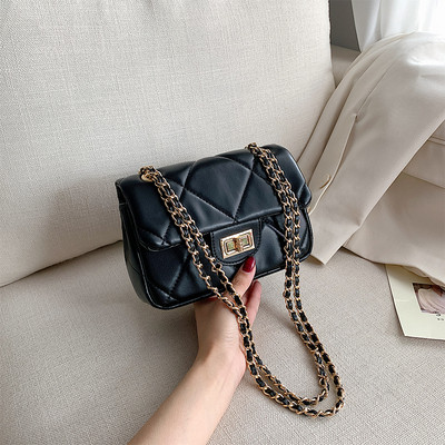 Modern női táska öko bőrből és hosszú fém fogantyúval