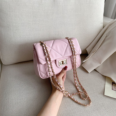 Modern női táska öko bőrből és hosszú fém fogantyúval