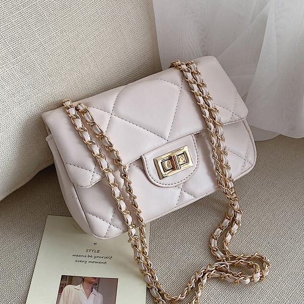 Modern női táska öko bőrből és hosszú fém fogantyúval