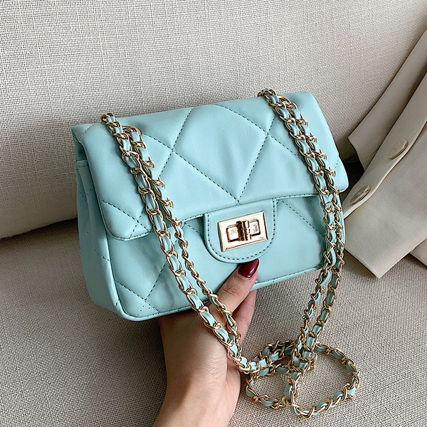 Modern női táska öko bőrből és hosszú fém fogantyúval