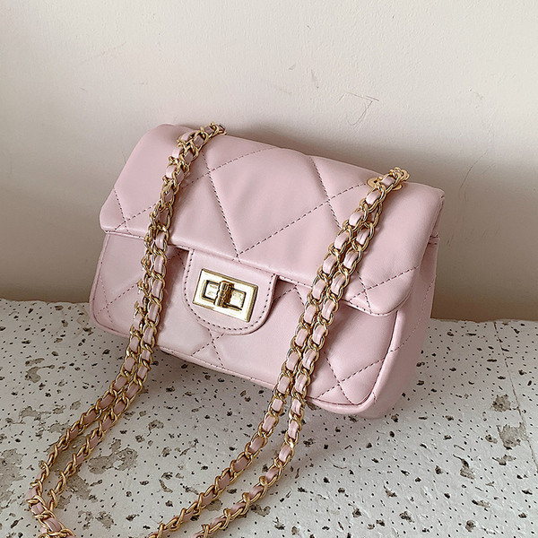 Modern női táska öko bőrből és hosszú fém fogantyúval