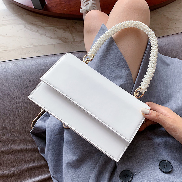 Stílusos női táska két füllel és egy rövid füllel gyöngyökkel - két modell