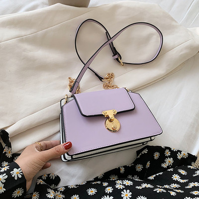 Modern női ökobőr táska fém elemmel és hosszú füllel