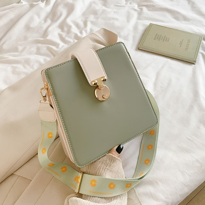 Alkalmi női táska fém elemmel, hosszú textil fogantyúval