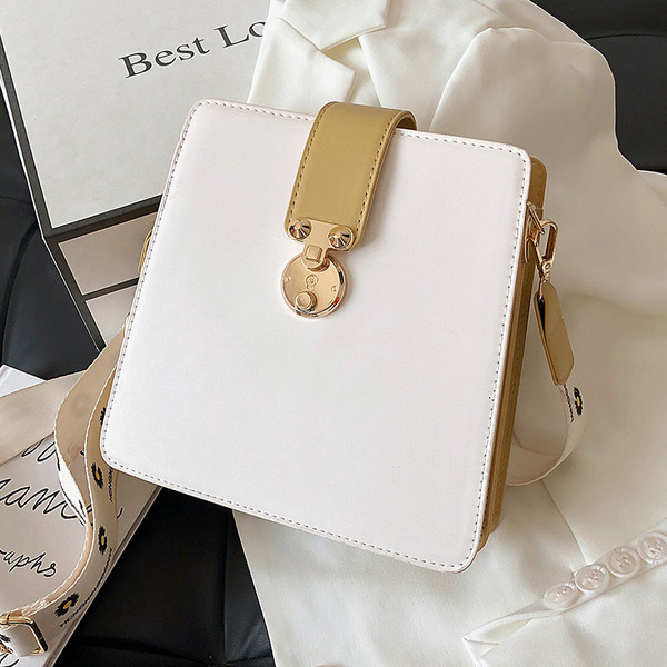 Alkalmi női táska fém elemmel, hosszú textil fogantyúval