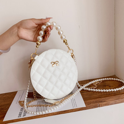 Modern női táska hosszú füllel - kerek forma