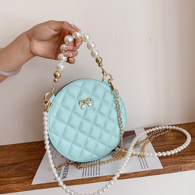 Modern női táska hosszú füllel - kerek forma