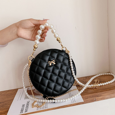 Modern női táska hosszú füllel - kerek forma