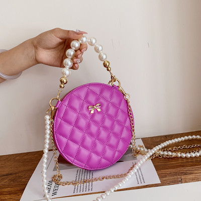 Modern női táska hosszú füllel - kerek forma