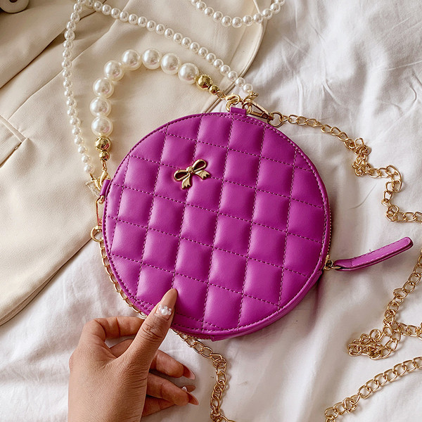 Modern női táska hosszú füllel - kerek forma