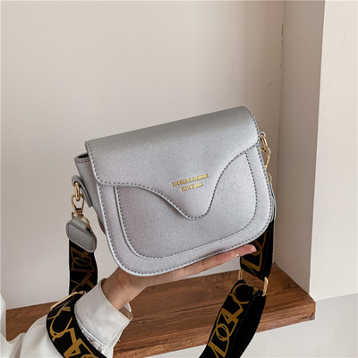 Műbőr női táska textil fogantyúval