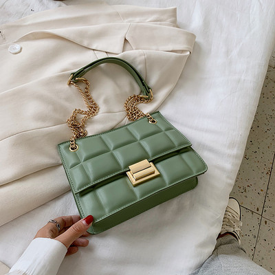 Stiilne metallist kinnitusega ökonahast naistekott