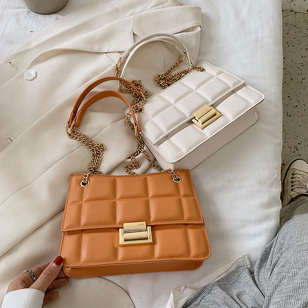 Stiilne metallist kinnitusega ökonahast naistekott