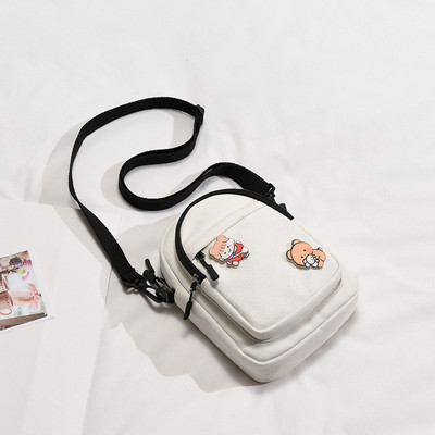 Mitmes värvitoonis aplikatsiooniga naiste tekstiilist kott