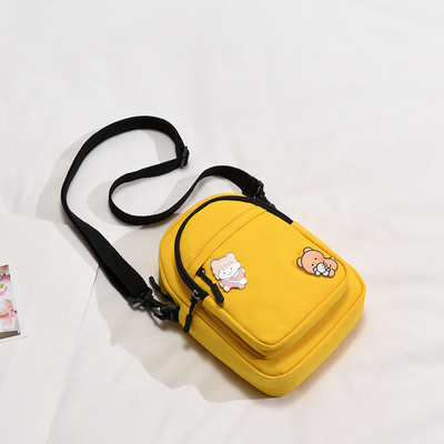 Mitmes värvitoonis aplikatsiooniga naiste tekstiilist kott