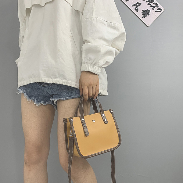 Σύγχρονη γυναικεία τσάντα με μακριά και κοντή λαβή από οικολογικό δέρμα