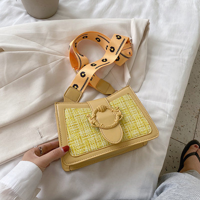 Női táska textil fogantyúval és fém elemmel