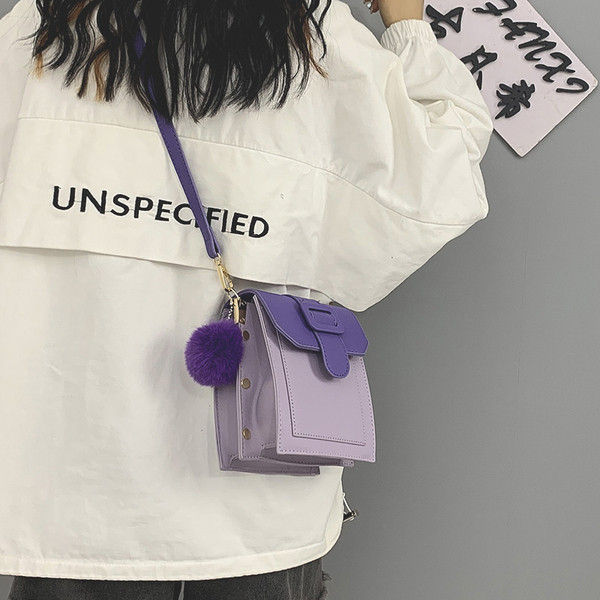 Moderni moteriška odinė rankinė su ilga rankena ir pūkeliu