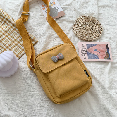 Γυναικεία υφασμάτινη τσάντα με μακριά λαβή και κορδέλα