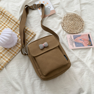 Γυναικεία υφασμάτινη τσάντα με μακριά λαβή και κορδέλα