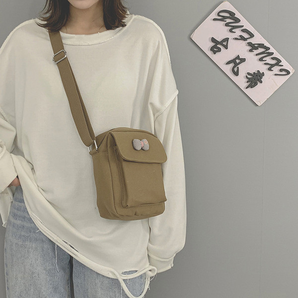 Γυναικεία υφασμάτινη τσάντα με μακριά λαβή και κορδέλα