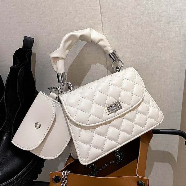 Stilīga sieviešu soma ar īsu rokturi un metāla aizdari