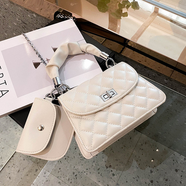 Stilīga sieviešu soma ar īsu rokturi un metāla aizdari