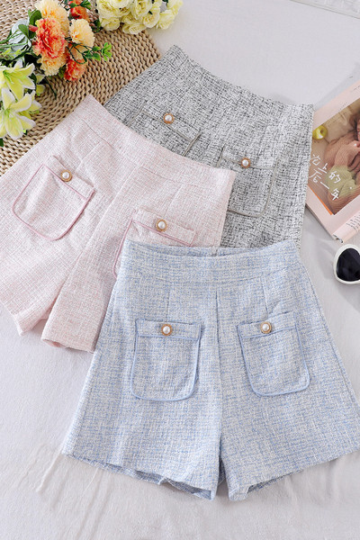 Naiste lühikesed püksid taskute ja kõrge vöökohaga