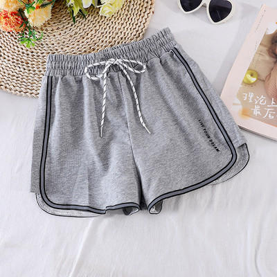 Sport és alkalmi női nadrág gumival és fűzővel