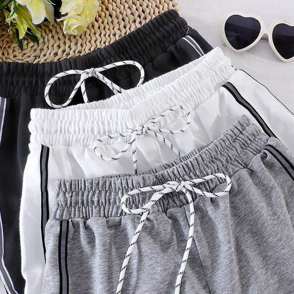 Sport és alkalmi női nadrág gumival és fűzővel