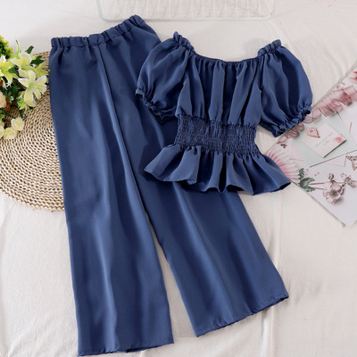 Modern női szett hosszú nadrágot és rövid ujjú blúzt tartalmaz