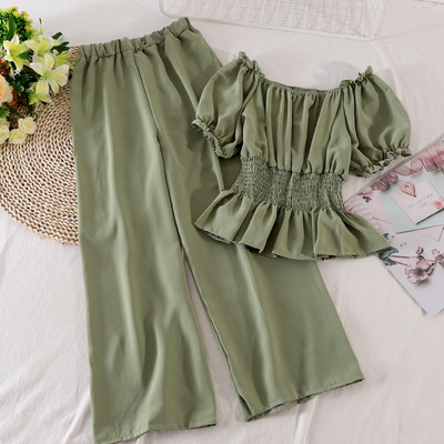 Modern női szett hosszú nadrágot és rövid ujjú blúzt tartalmaz