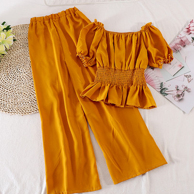 Modern női szett hosszú nadrágot és rövid ujjú blúzt tartalmaz