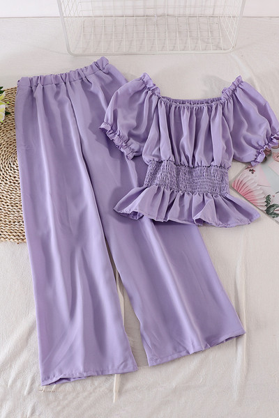 Modern női szett hosszú nadrágot és rövid ujjú blúzt tartalmaz